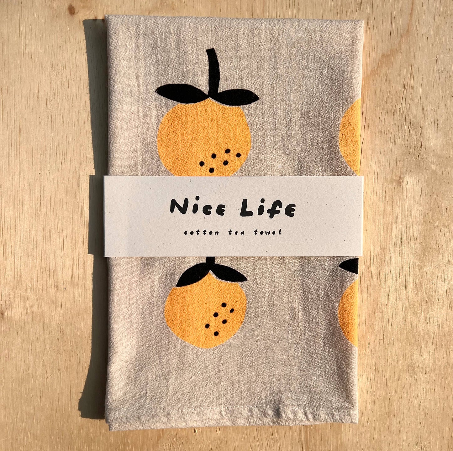 Orange screen printed tea towel