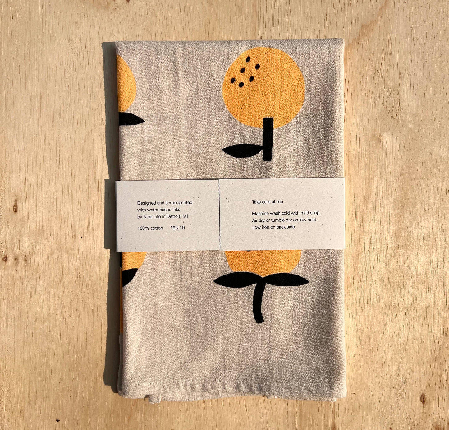 Orange screen printed tea towel