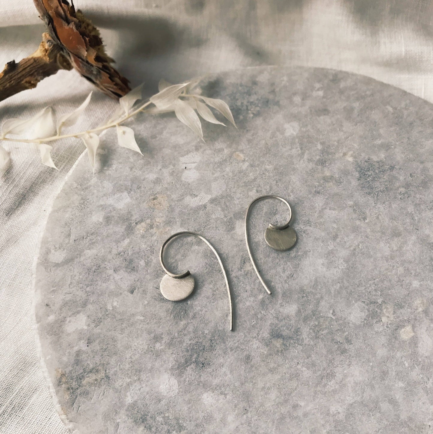 Tiny silver disc hoop