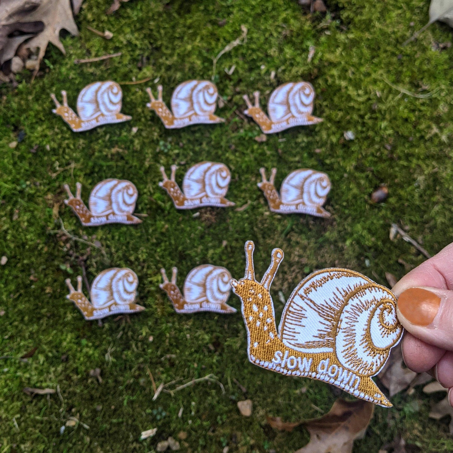 Iron-on patch | slow down snail - brown 1.6" x 2.6"