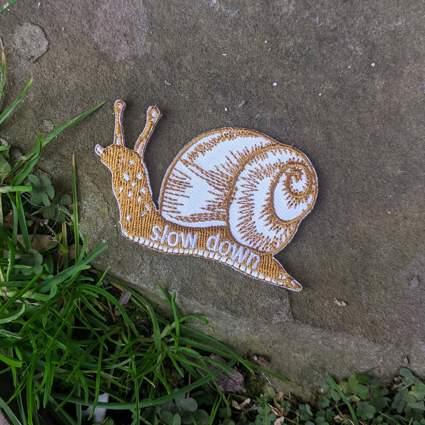 Iron-on patch | slow down snail - brown 1.6" x 2.6"