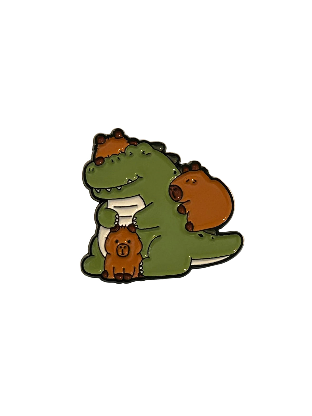 A cartoon enamel pin featuring a green dinosaur hugging three small brown animals, shown on a plain off-white surface with a finger partially visible at the bottom left.