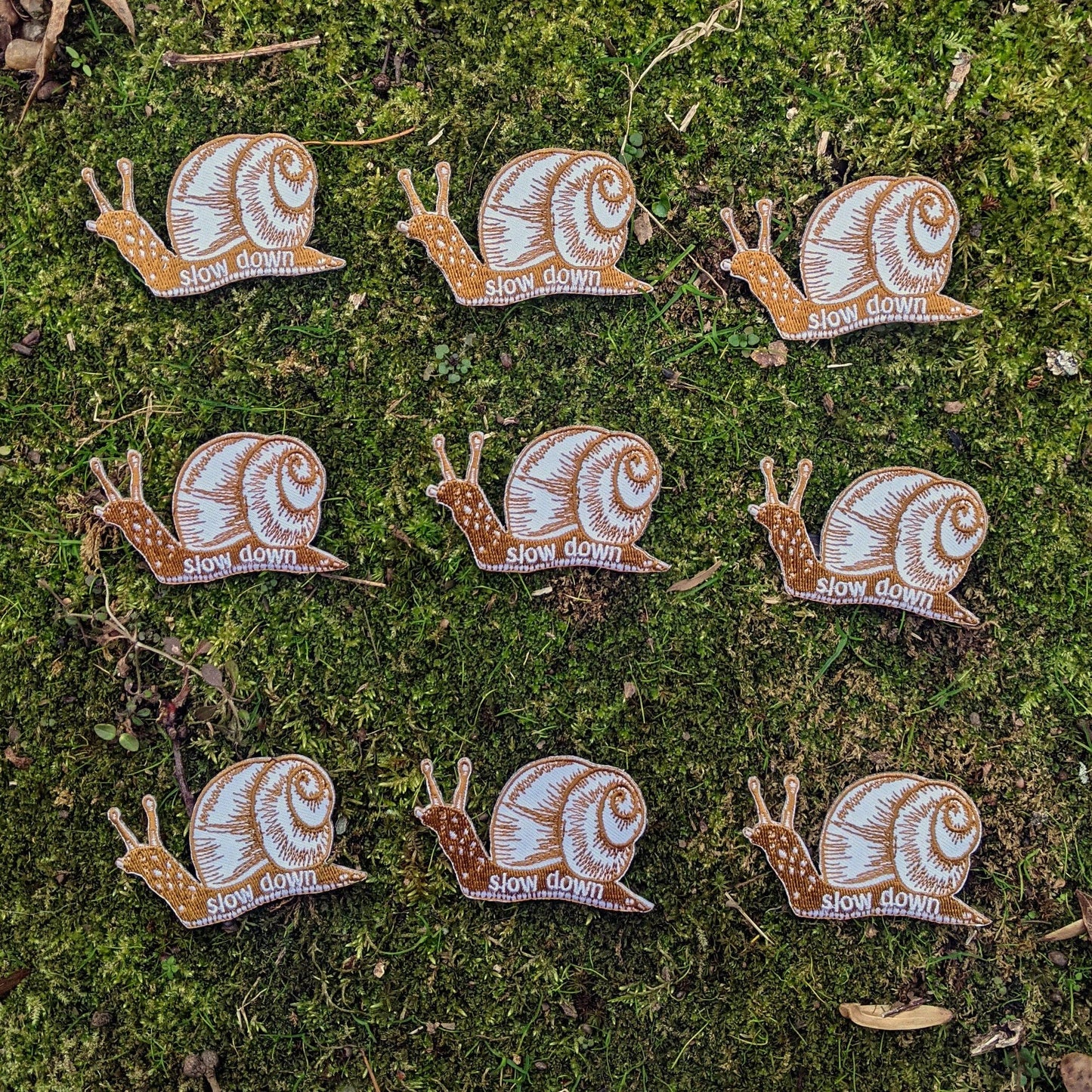 Iron-on patch | slow down snail - brown 1.6" x 2.6"
